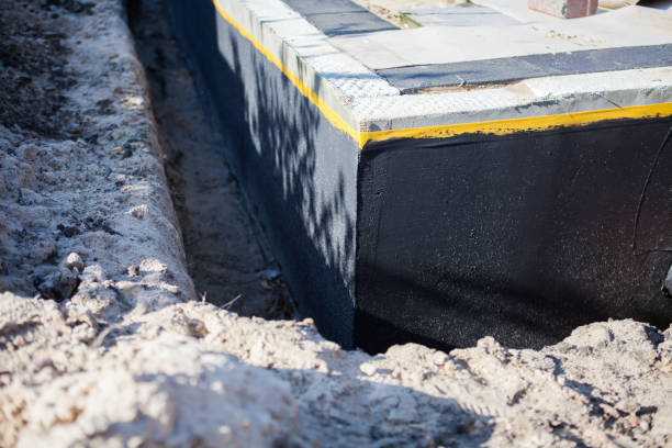 Professional Waterproofing technician working in Basom, NY